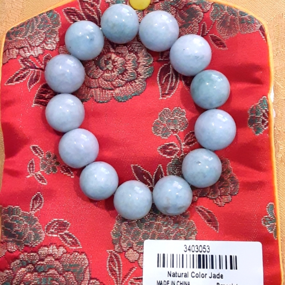 Natural color jadeite bracelet.